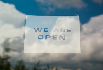 End of quarantine. Sign of greeting text message we are open after the quarantine due to covid-19. Hotel, cafe, local shop, service opening. Support local business.