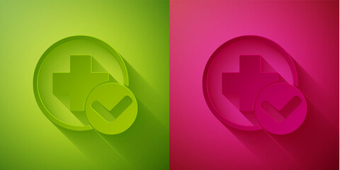 Paper cut Cross hospital medical icon isolated on green and pink background. First aid. Diagnostics symbol. Medicine and pharmacy sign. Paper art style. Vector Illustration