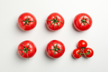 Flat lay with ripe tomatoes on white background, top view