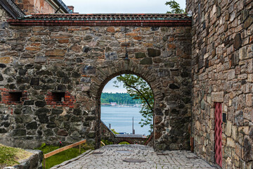 Oslo, Norway Akershus fortress. Stone arch with a view of the fjord