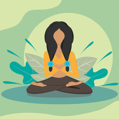 A young woman sits cross-legged on the floor and meditates. Meditation, relaxation at home, spiritual practice, yoga and breathing exercise. Quarantine