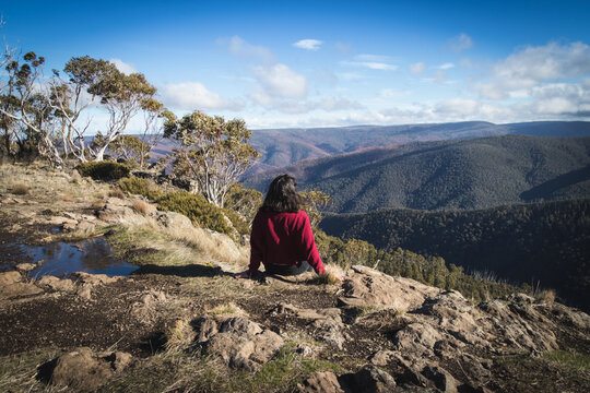 Woman looking at the horizon after hiking
