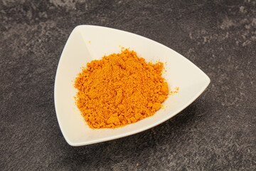 Tumeric powder in the bowl