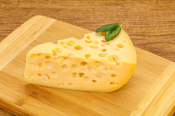 Maasdam cheese - yellow triangle with holes