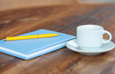  notepad and coffee in cafe