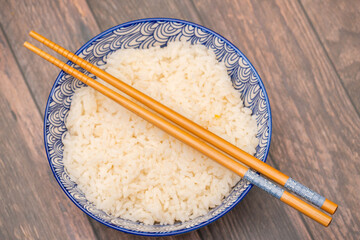 Bowl of rice with chopsticks