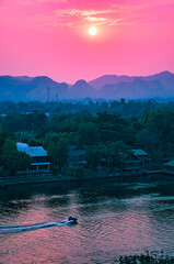 Beautiful glowing pink sunset over the River Kwai