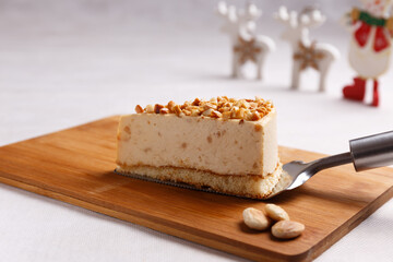 Nougat piece of nougat cake on wooden board