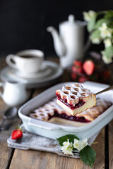 piece of delicious berry pie with strawberries with cup of coffee for breakfast. Vertical