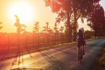 Cycling in the sunset - road bike