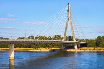 Fototapeta na wymiar Swietokrzyski Bridge over the Vistula river in Warsaw, Cable-Stayed type of bridge