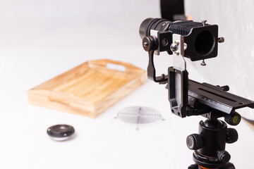 Photography studio, bellows and lens mounted on rail