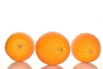 Ripe, organic orange, macro, on a white background.
