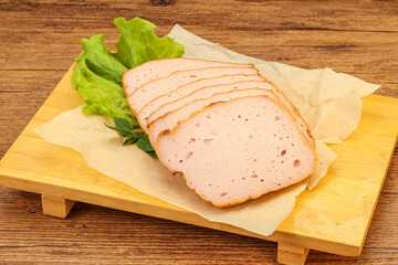 Boiled pork sausage over board