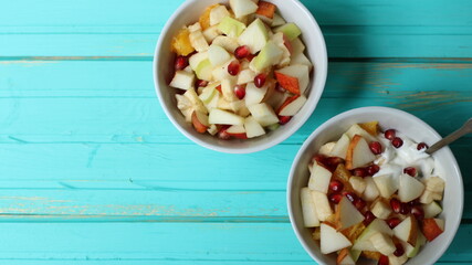 background of fruit breakfast for two served on a blue wooden table and copy space