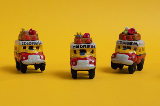 handicraft of autochthonous Colombian means of transport, the chiva or stair bus yellow background