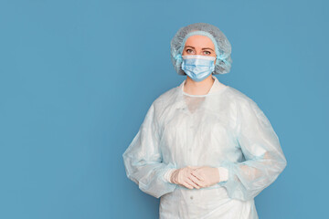 The doctor in a dressing gown, in medical gloves and masks. Surgeon with clinical experience in healthcare, patient care
