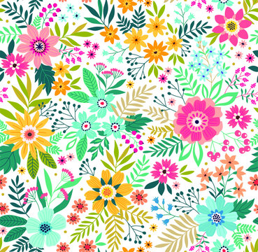 Trendy seamless vector floral pattern. Endless print made of small colorful flowers, leaves and berries. Summer and spring motifs. White. Vector illustration.
