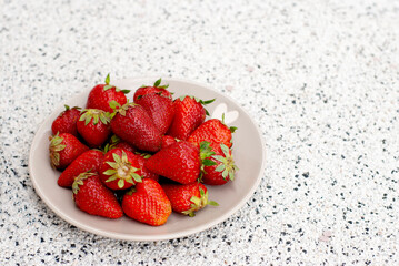 strawberries in a glass bowl