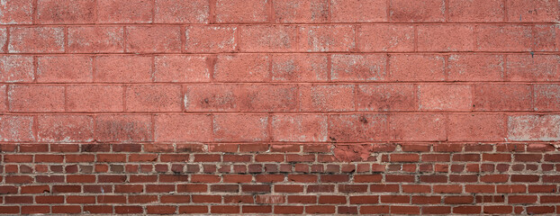 Split panoramic background of vintage red brick and painted concrete block, creative copy space option, horizontal aspect