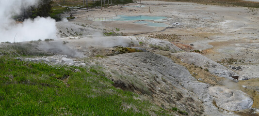 Late Spring in Yellowstone National Park: Steam from Black Growler, Lewis Mud Pots and Ledge Geyser Geothermal Features in the Porcelain Basin Area of Norris Geyser Basin
