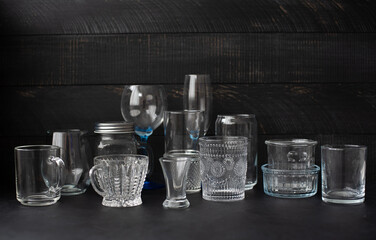 glass goblets and glasses on a black background