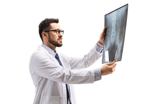 Young male doctor specialist looking at an x ray scan