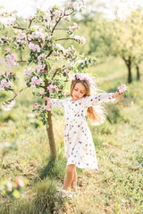 cute girl posing in the spring garden