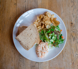 Egg sandwich with salad and crisps