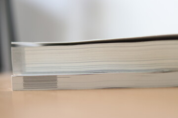 Books, Thick heavy books with white paper and hard cover, good binding, perfect binding, large number of pages, huge page booklet on table