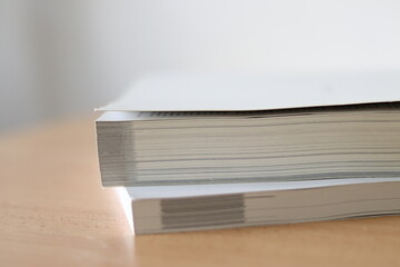 Books, Thick heavy books with white paper and hard cover, good binding, perfect binding, large number of pages, huge page booklet on table