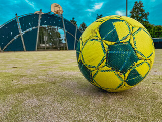 soccer ball on an abandoned basketball court