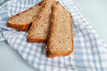 fresh hot homemade bread from rye flour on a kitchen towel
