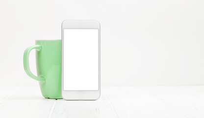 Workplace with smartphone and coffee cup
