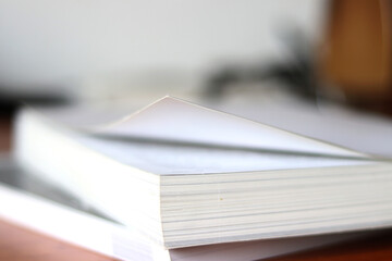 Books, Thick heavy books with white paper and hard cover, good binding, perfect binding, large number of pages, huge page booklet on table