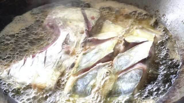 Frying Alectis ciliaris in the pan and frying oil