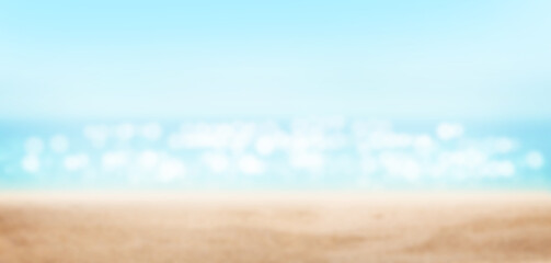 Summer tropical sea with sparkling waves, sand and blue sunny sky