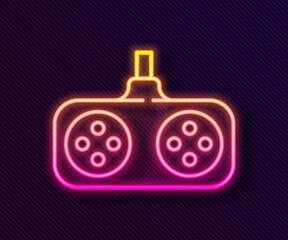 Glowing neon line Gamepad icon isolated on black background. Game controller. Vector Illustration