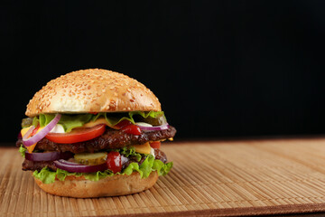 classic american burger on dark background