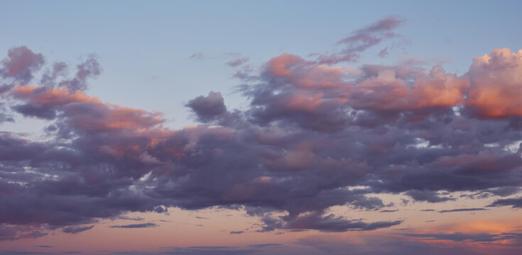 Evening sky with clouds. Blue hours sky. Pink afternoon vanilla sky