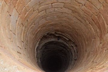 Well shaft made of stone at a desert castle / bathhouse for caravans, Amman, Jordan