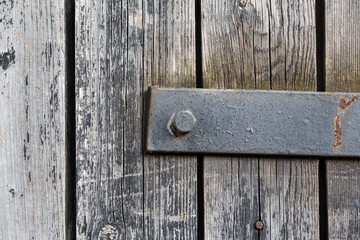  gray wooden planks with a horizontal metal strip