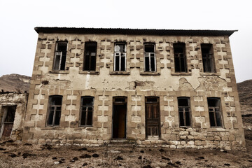 Abandoned house with stucco architraves