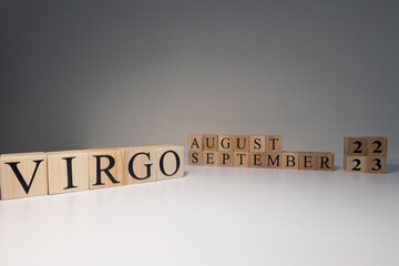 Virgo word on wooden cubes on white background.