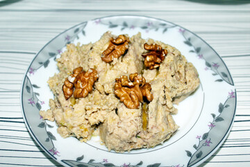 Delicious hummus with olive oil and walnuts. 
Appetizer made with chickpeas.