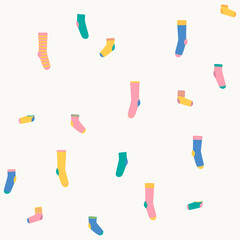 Vector illustration with randomly located colorful socks. Seamless pattern.