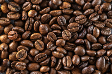Coffee beans on black caffeine breakfast background. For cup of dark espresso food or drink. Assorted ground and instant brown roasted coffee seeds on stone. Copy space, top view