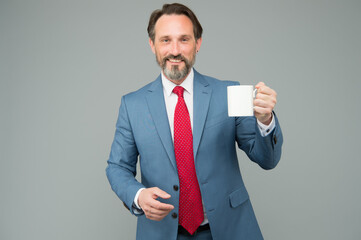 taste of energy. businessman on lunch break. boss inspired with fresh beverage. mature boss need more energy. successful bank employee drink morning coffee. have business lunch. attorney with tea cup
