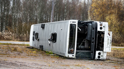 Broken after accident bus on its side.