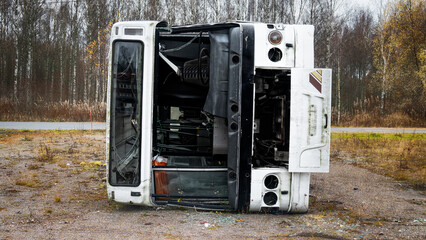 Broken after accident bus on its side.
